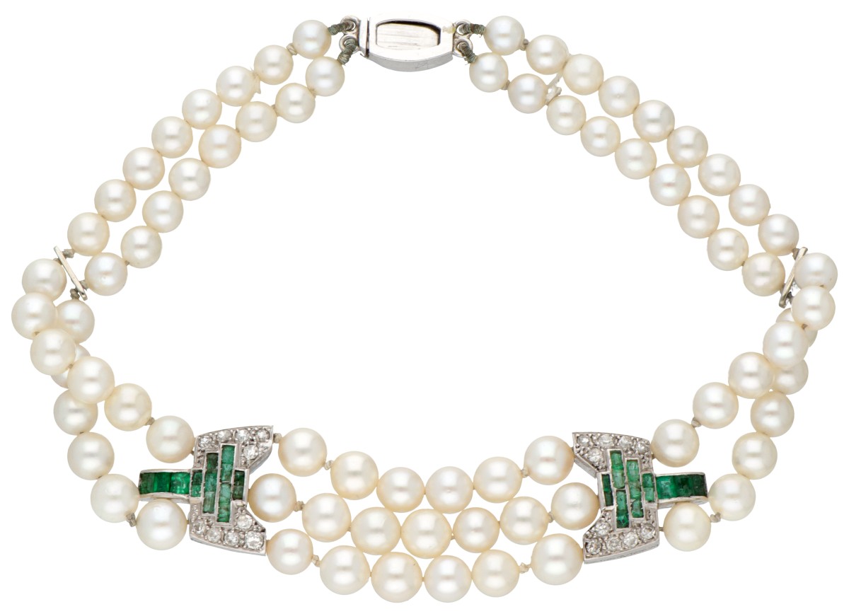 14 kt. Witgouden art deco parel armband en tussenstukken bezet met smaragd en diamant.