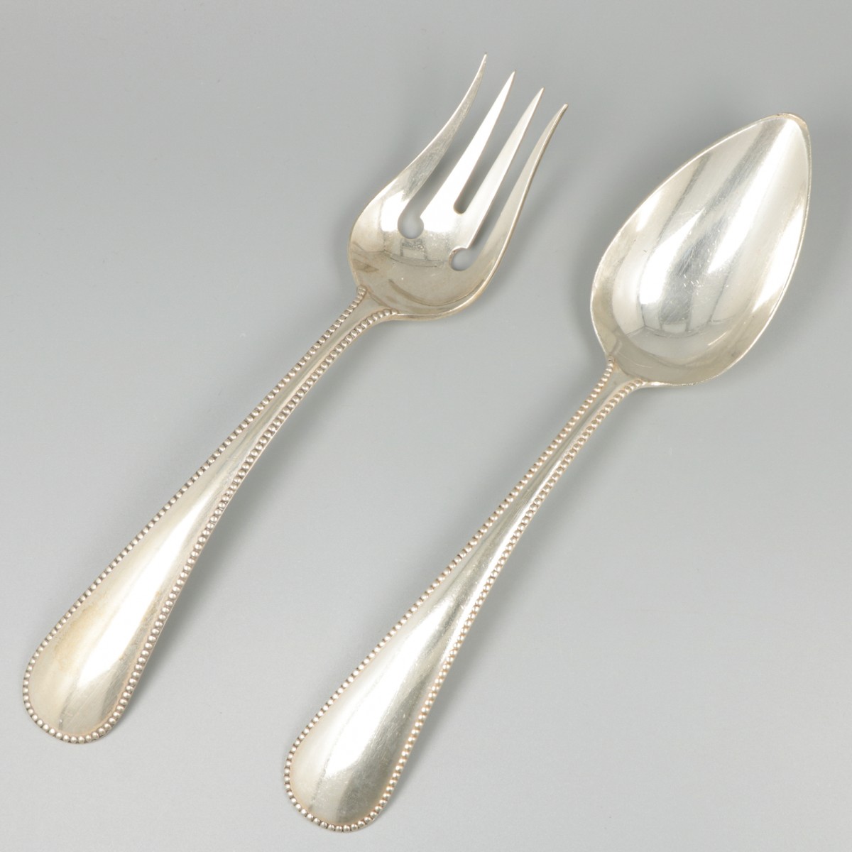 Slacouvert zilver.