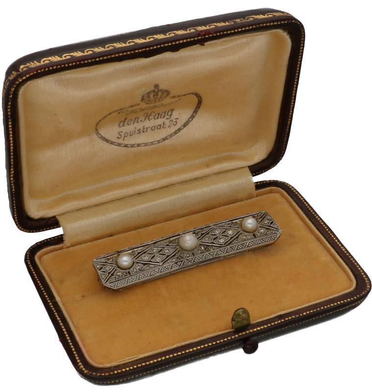 Broche witgoud, ca. 0.25 ct. diamant en parel - 14 kt.