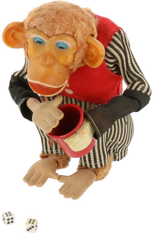 Een “Cragstan Industries, New York” dobbelende chimpansee. Made in Japan. Ca. 1950.