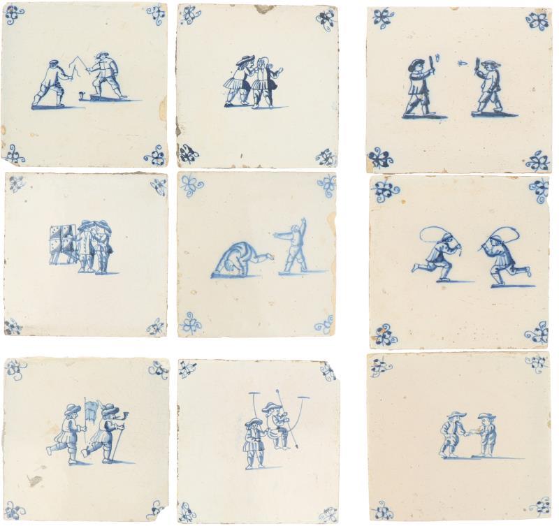 Een lot van negen aardewerk tegels met decor van kinderspelen. Holland 19e eeuw en later.
