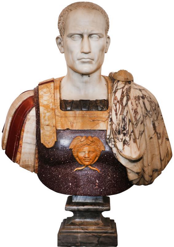 Italiaanse School, 20e eeuw. Een Marmeren buste van Julius Ceasar in onder andere Carrara wit en Alicante rood marmer.