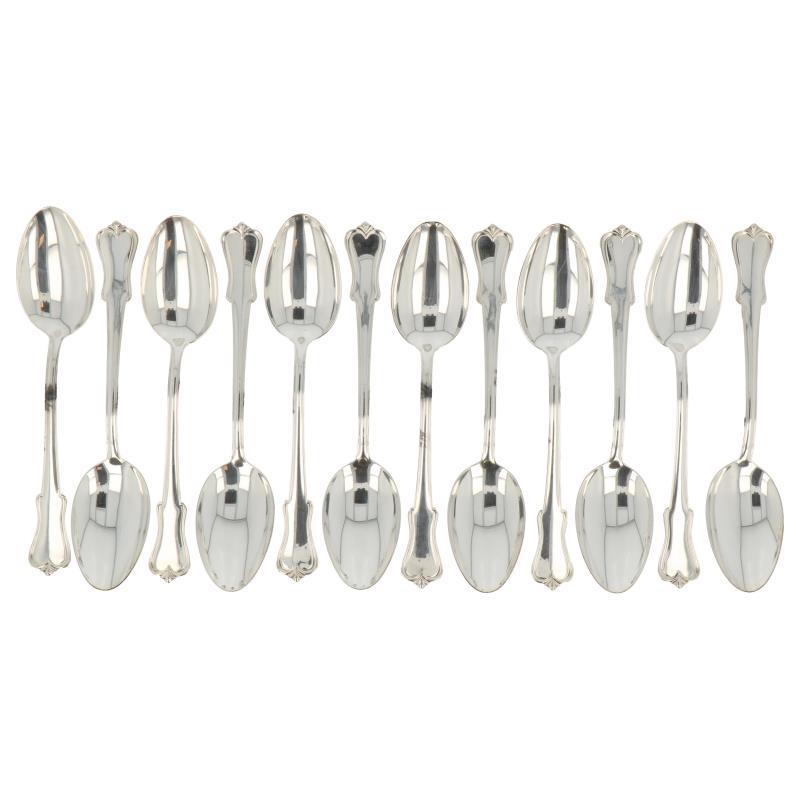 (12) Delige set ontbijt lepels OKA zilver.