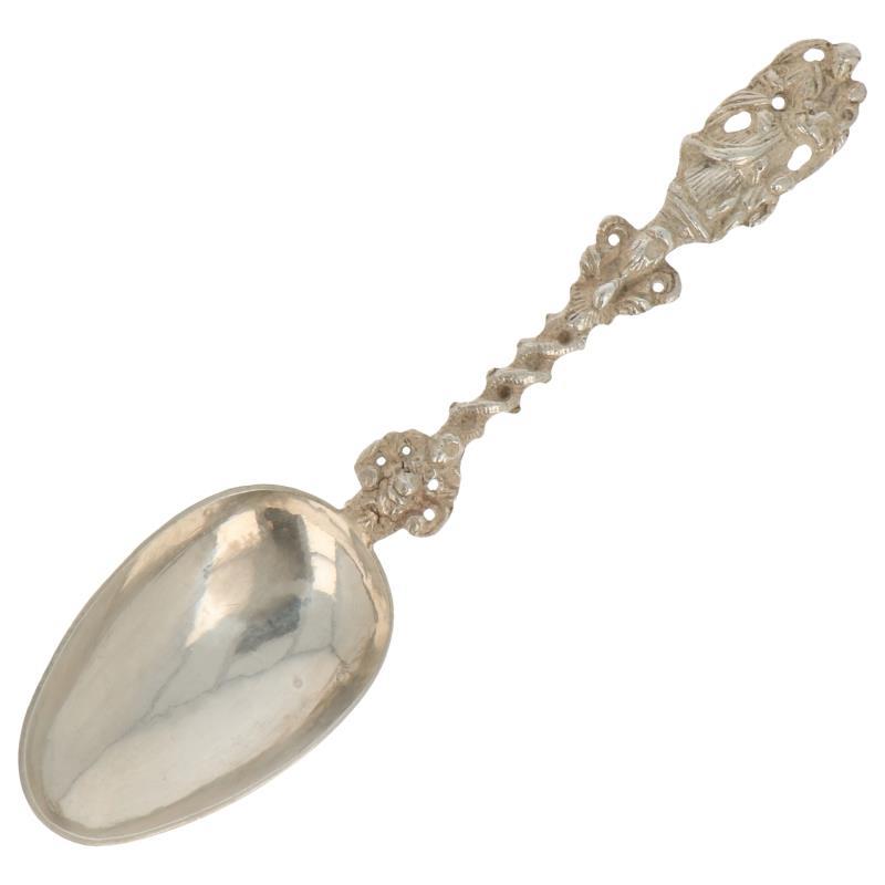 Gelegenheids lepel met gegoten gevlochten steel zilver.