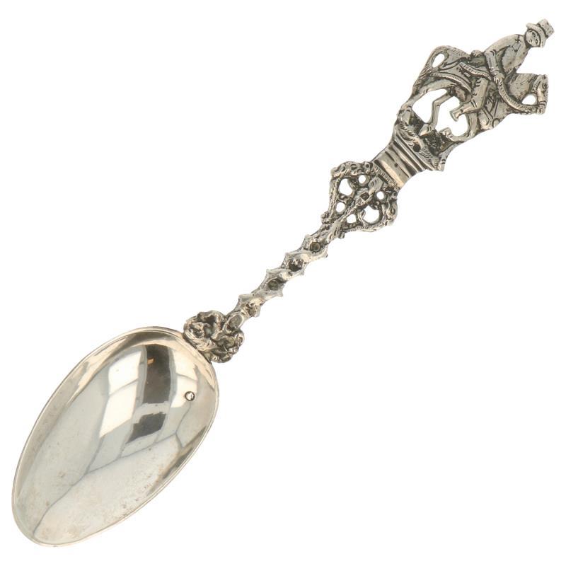 Gelegenheids lepel met gegoten Ruiter te paard zilver.