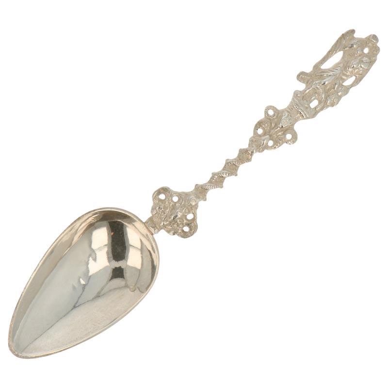Gelegenheids lepel met gegoten engel op gevlochten steel zilver.