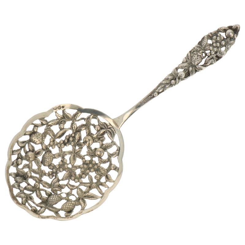 Natfruit schep met gegoten decoraties en opengewerkte bak zilver.