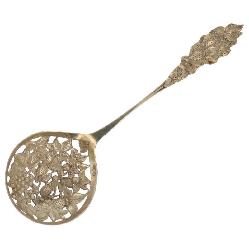 Natfruit schep met gegoten decoraties en opengewerkte bak zilver.