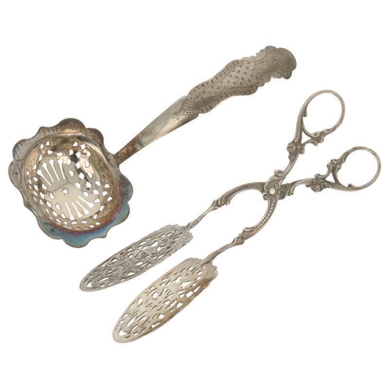 (2) Delig lot w.o. strooilepel met gegraveerde biedemeier versieringen en een caketang zilver.