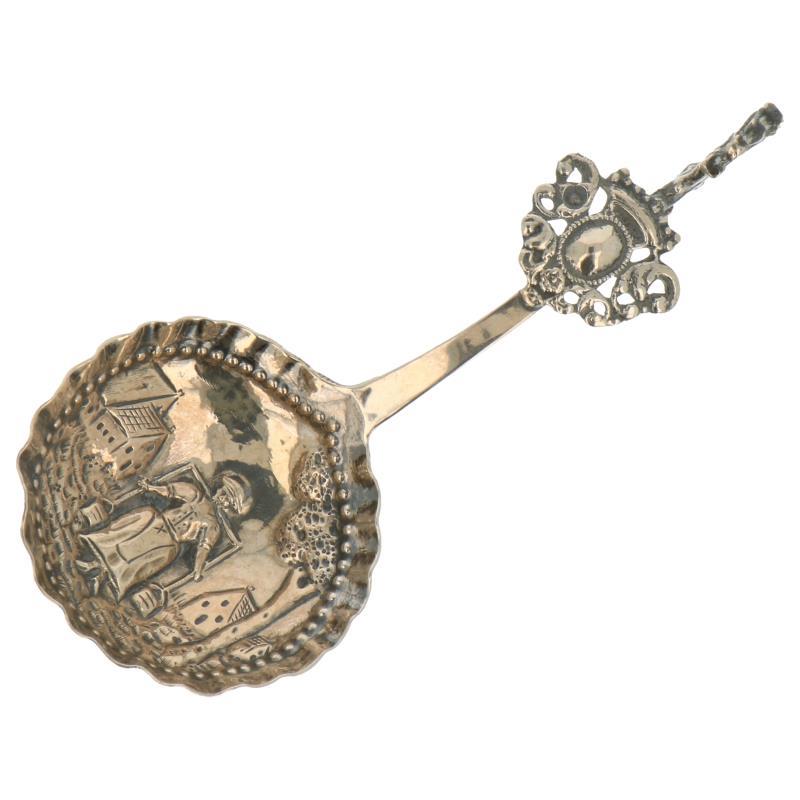 Roomlepel met hollandse gedrukte en gehammerde decors zilver.