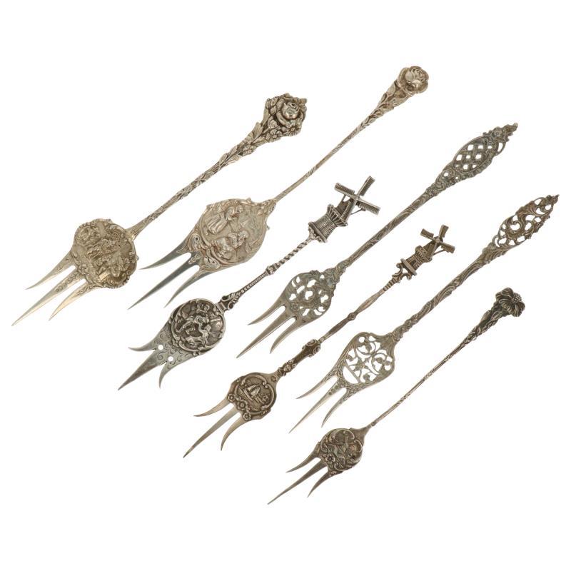 (7) Delig lot cakevorken met diverse decoraties zilver.