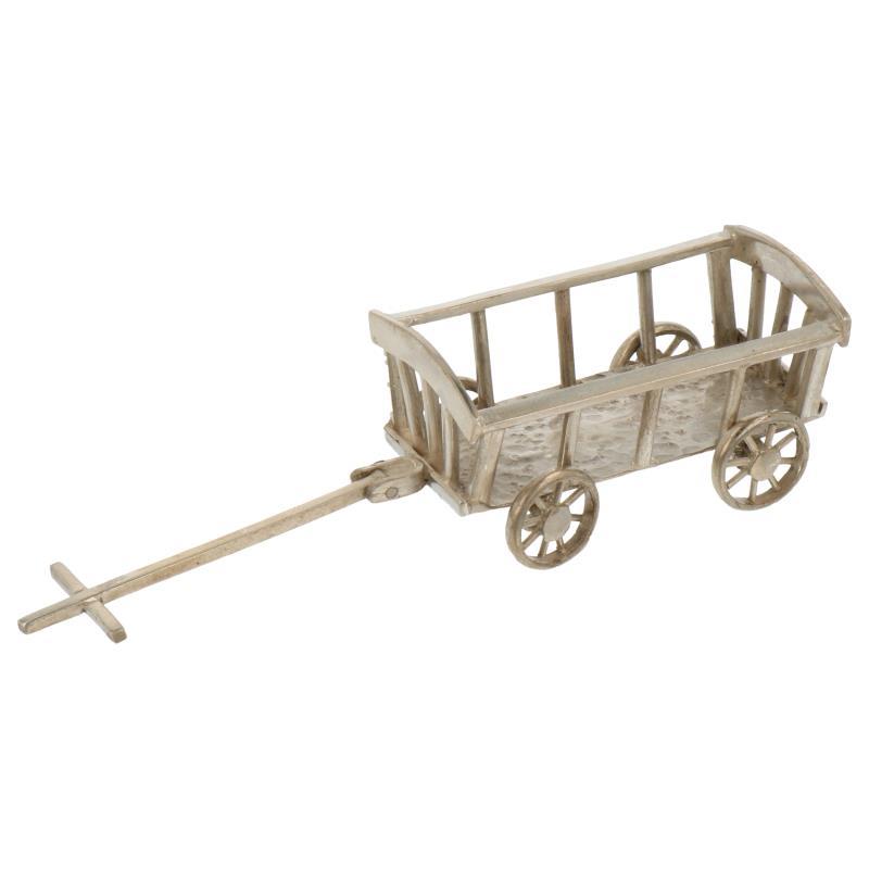Miniatuur bolder of handkar met gebogen voor en achterkant zilver.