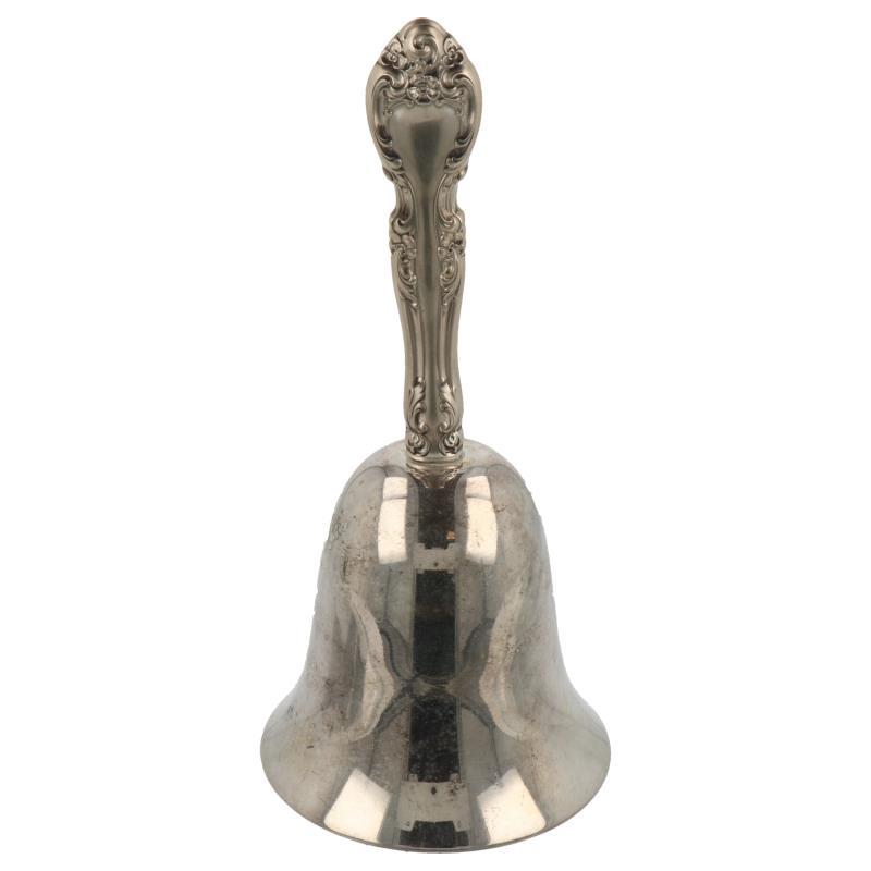 Tafelbel met bewerkt handvat in barok stijl en rvs bel zilver.