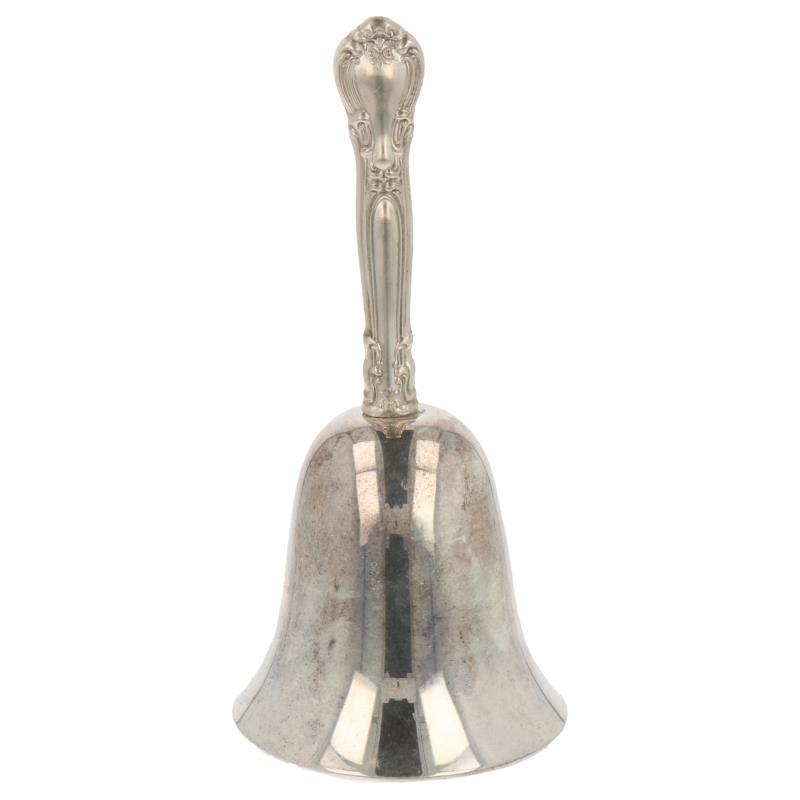 Tafelbel met bewerkt handvat in barok stijl en rvs bel zilver.