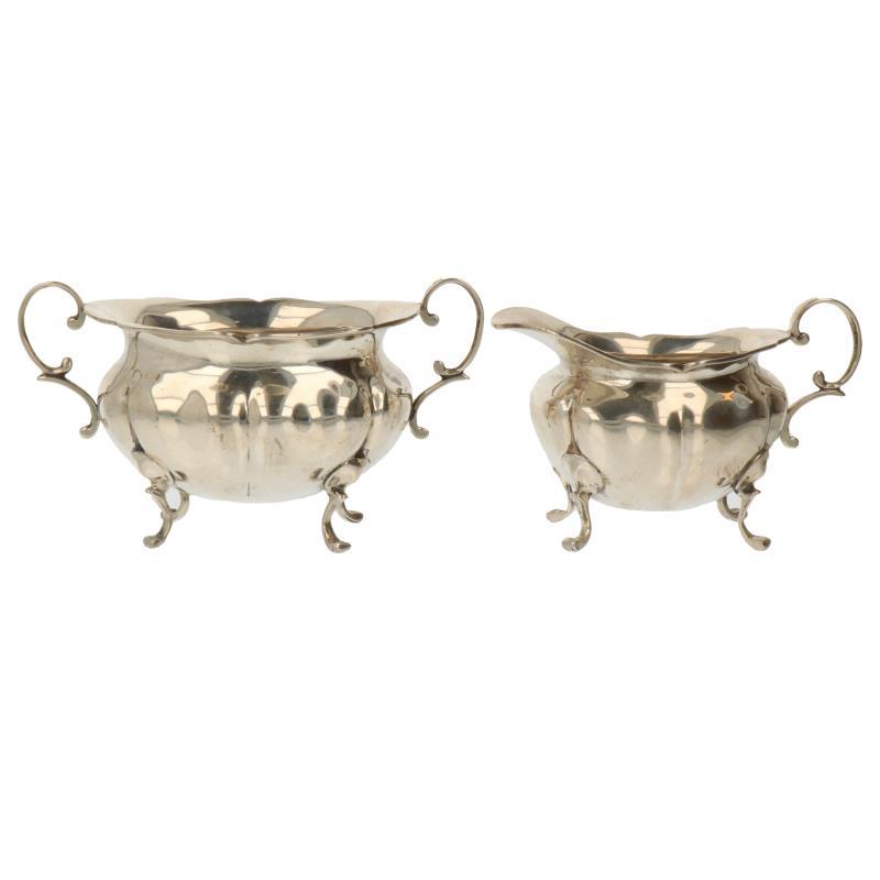 (2) Delig roomstel gelobt model elk op 4 pootjes zilver.