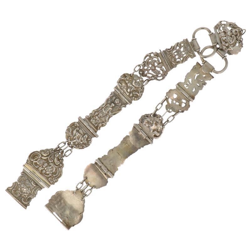Riem bestaande uit diverse bijbelsloten zilver.
