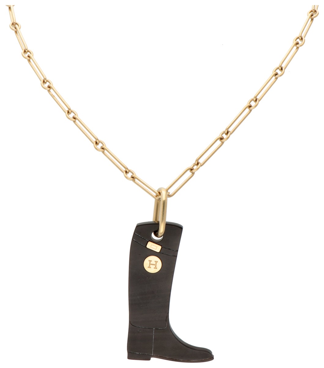Hermès rijlaars hanger aan verguld collier.