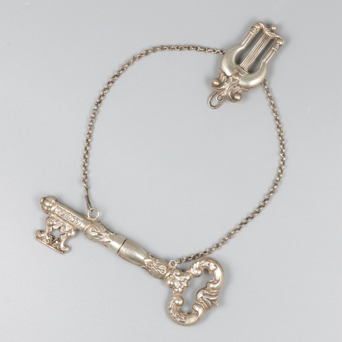 Breipenhouder "sleutel", zilver.
