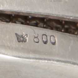 Beugeltas zilver.
