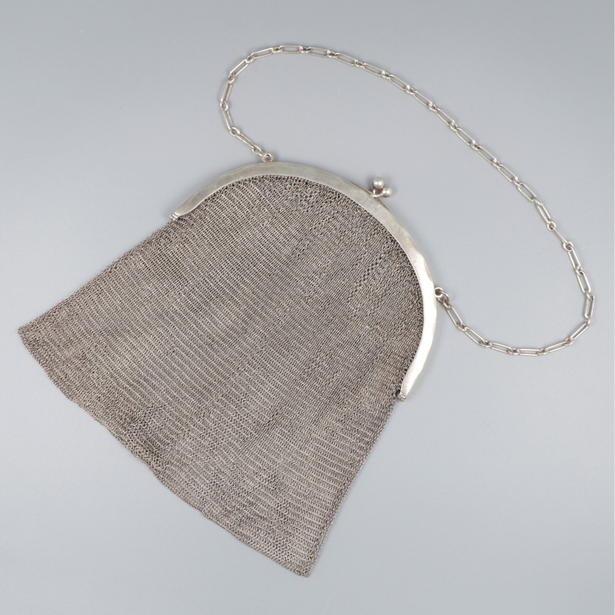 Beugeltas zilver.