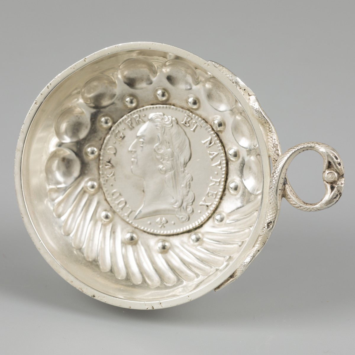 Tastevin zilver.