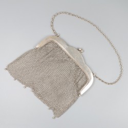 Beugeltas zilver.