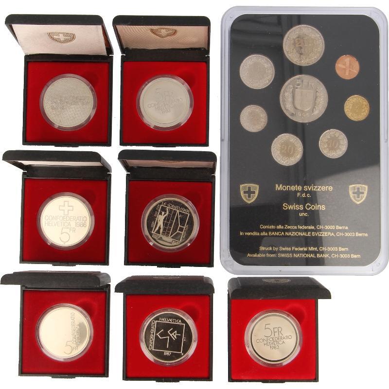 Zwitserland. FDC set 1986 and seven 5 francen periode 1983-1989 proof.