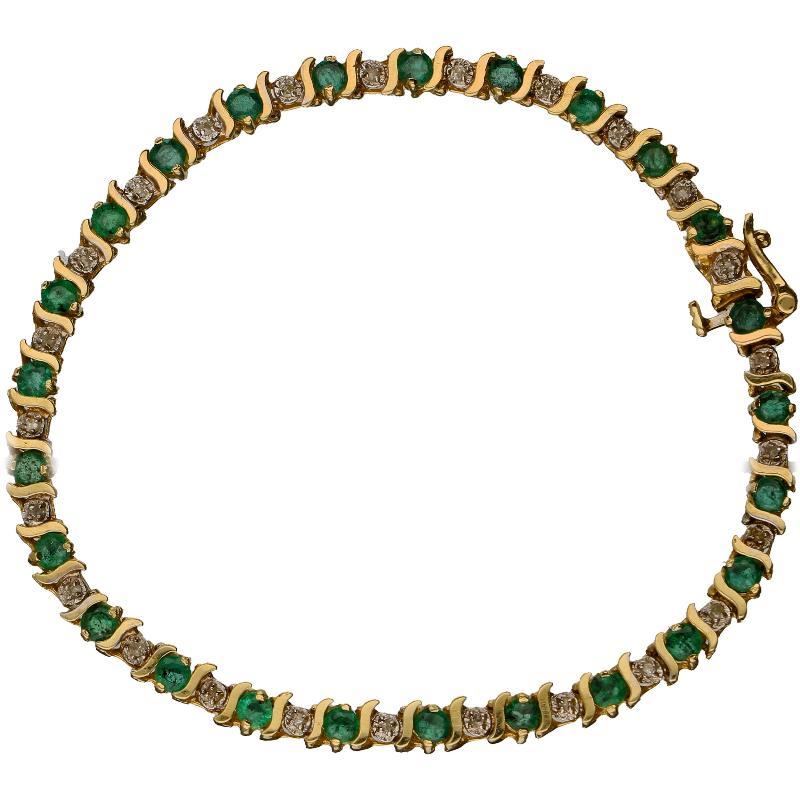 Geelgouden armband bezet met 25 briljant geslepen smaragden en 24 briljant geslepen diamanten, 14 karaat.