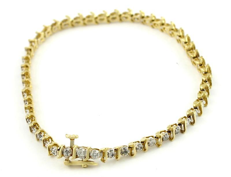 Geelgouden armband bezet met briljant geslepen diamanten, 14 karaat                                                                                                                                                                                            