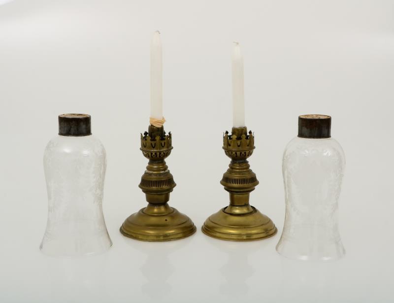 A set with (2) candles with etched glass wind lights.
