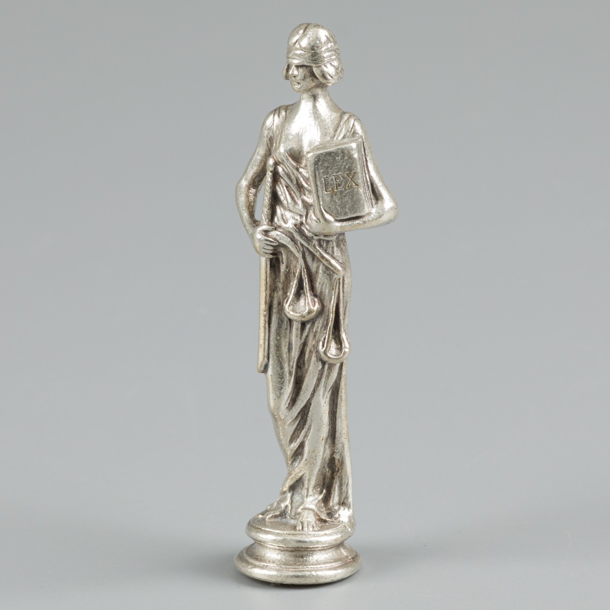 Lakstempel zilver.