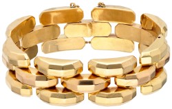 Brede 18K bicolour gouden vintage schakelarmband met gefacetteerde schakels.