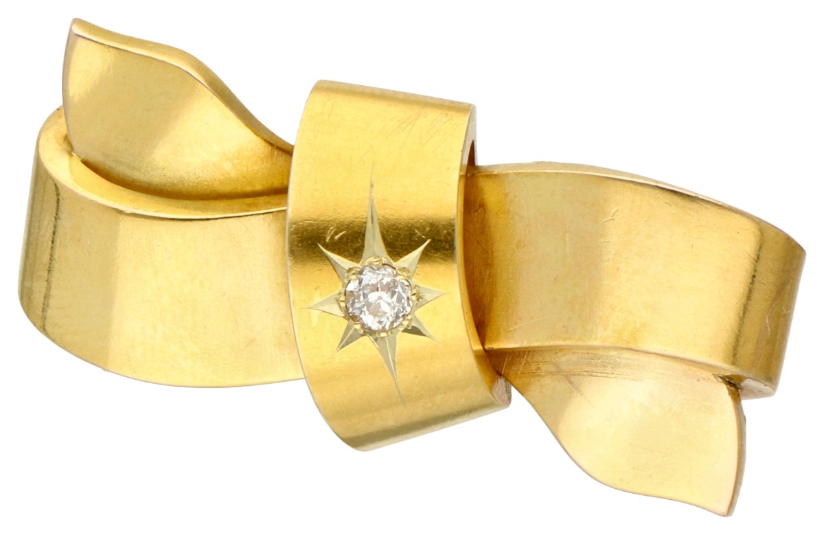 18K Geelgouden strikbroche met diamant.