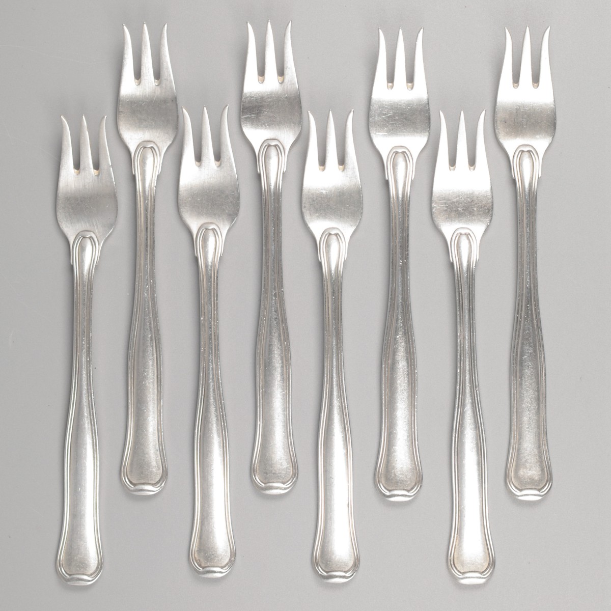 Georg Jensen 8-delige set oestervorkjes, model Old Danish, zilver.