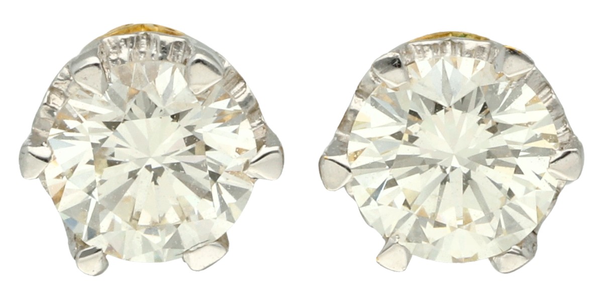 18K Geelgouden solitair oorstekers met ca. 0.60 ct diamant.