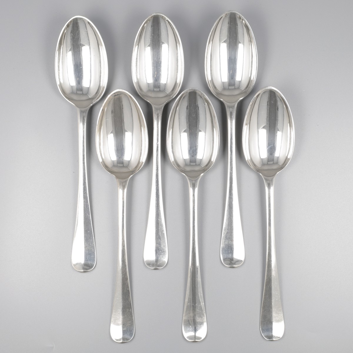 6-delige set dinerlepels "Haags lofje" zilver.