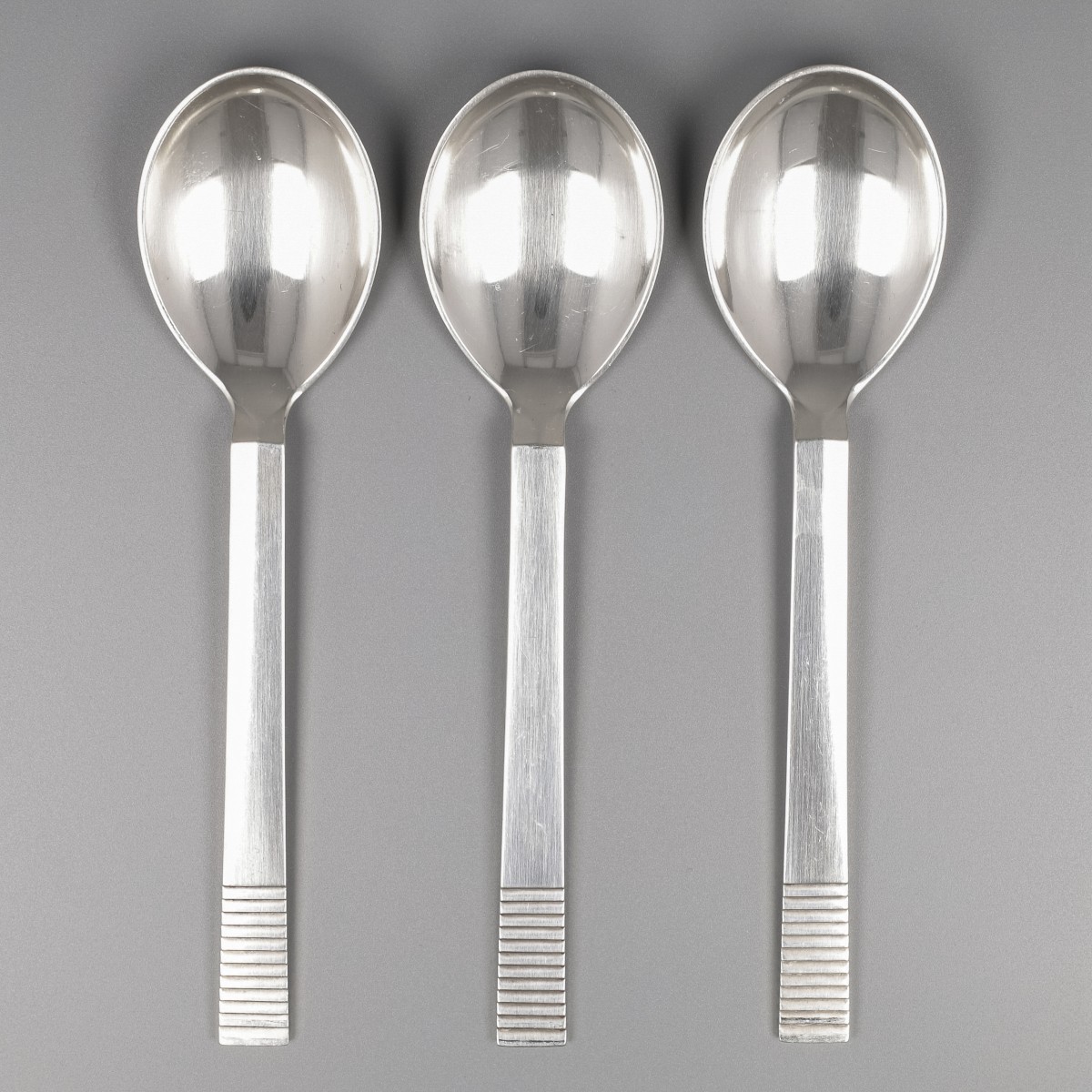 Georg Jensen lunchlepels (3), model Parallel, zilver. Ontworpen door Oscar Gundlach Pedersen in 1931.