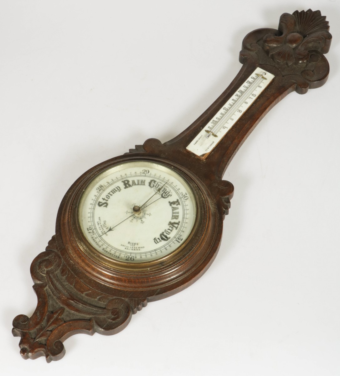 Een eikenhouten banjobarometer, Engeland, 20e eeuw.