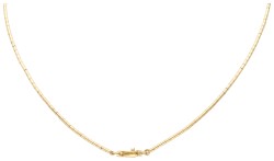Gouden/zilveren hanger aan collier.