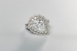 Crivelli 18K white gold certified halo ring set with approx. 3.12 ct. pear cut diamond and approx. 2.45 ct. surrounding diamonds.