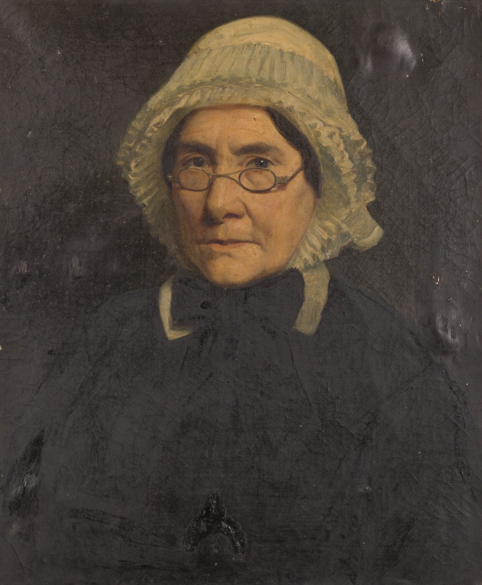 Hollandse School, ca. 1900. Portret van een bebrilde dame met kanten muts.