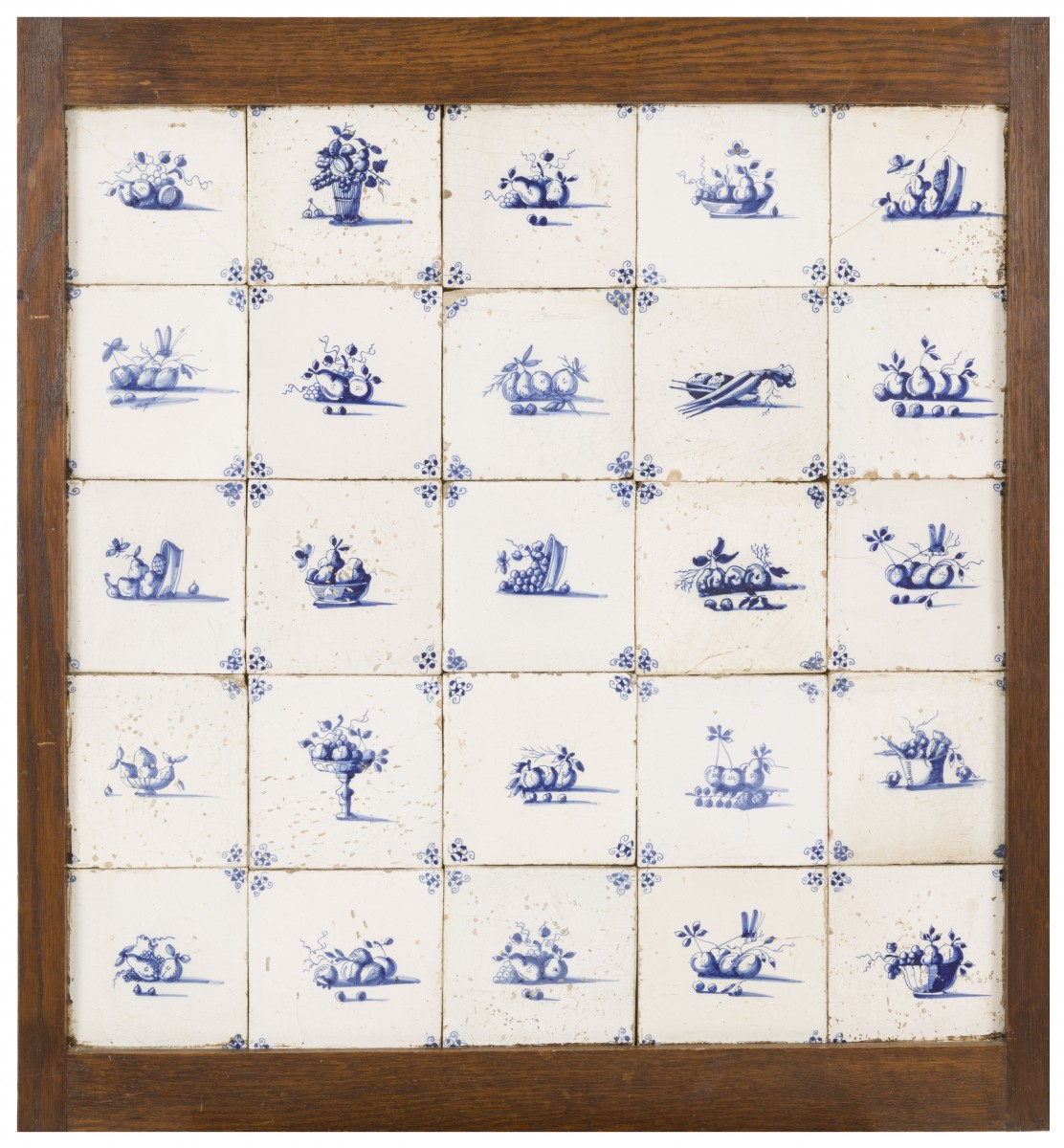 Een set van (25) tegels met blauw-wit decor, voorstellende diverse vruchten, Holland, 18e eeuw.