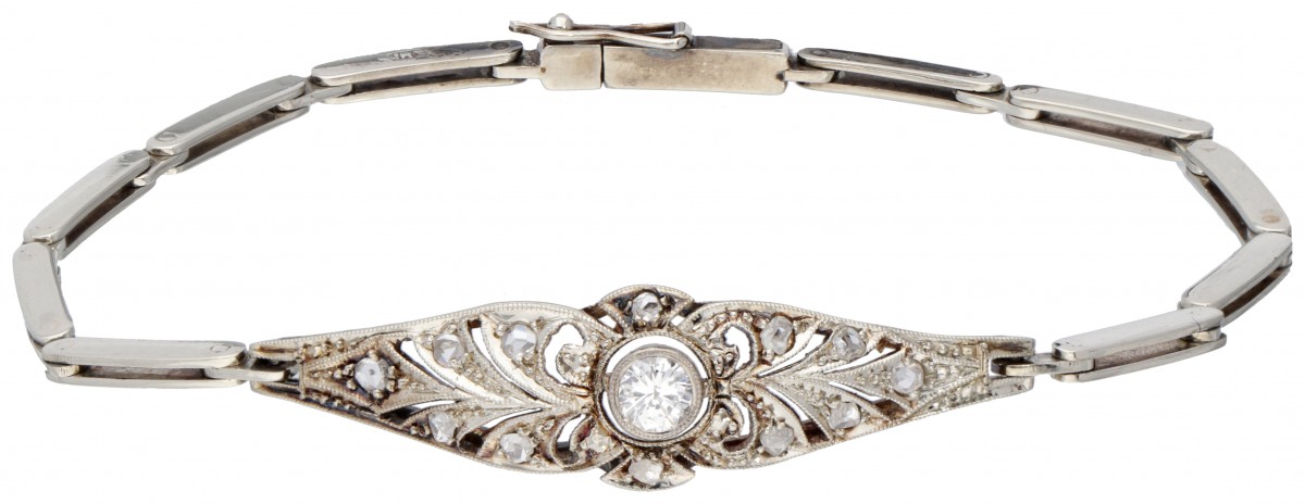 14 kt. Witgouden ajour / opengewerkte art deco armband bezet met ca. 0.15 ct. diamant.