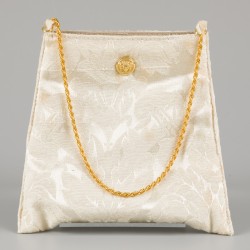 Een lot bestaande uit een handtasje en tegel gedecoreerd met Medusa. Versace.
