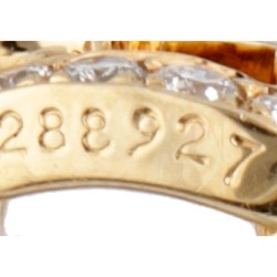 Cartier 18 kt. geelgouden oorbellen bezet met ca. 0.42 ct. diamant.