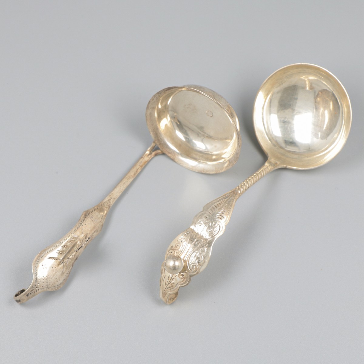 2-delig lot roomlepels zilver.