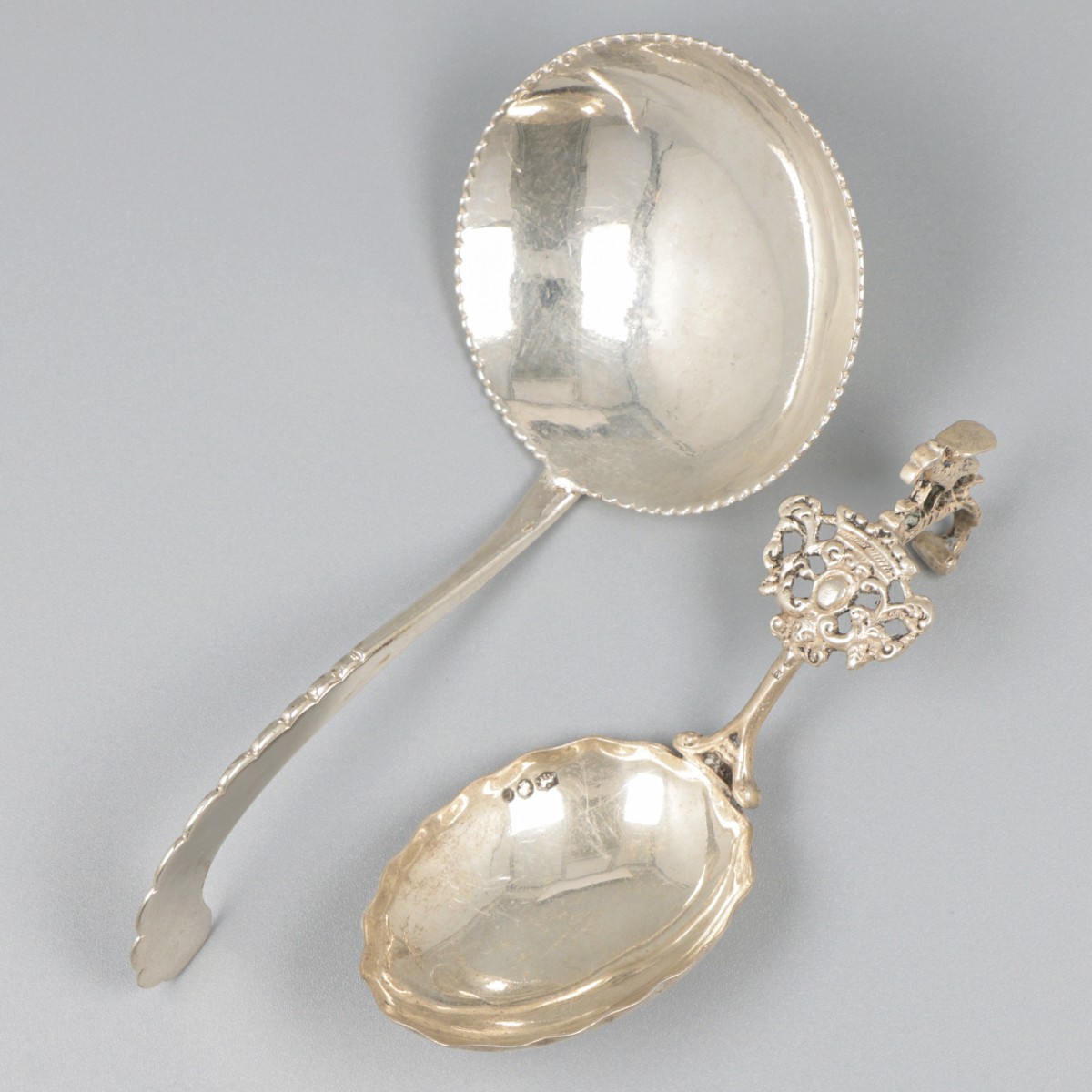 2-delig lot roomlepels zilver.