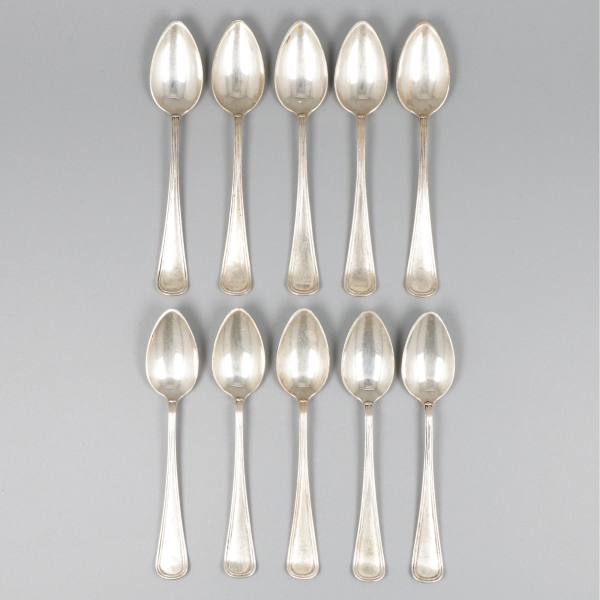 10-delige set thee- / koffielepels zilver.