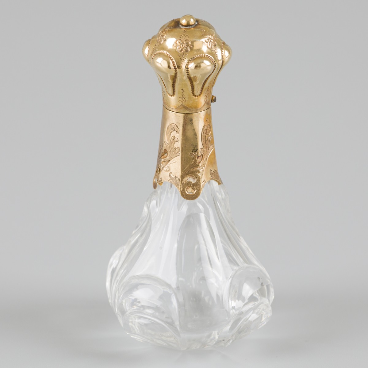 Parfumflacon goud.