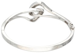 18 kt. Witgouden bangle armband bezet met ca. 0.45 ct. diamant.